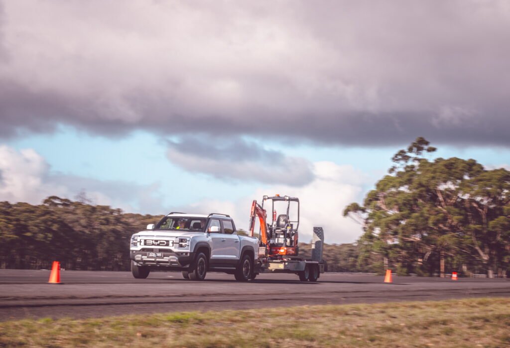 Truck towing equipment on road